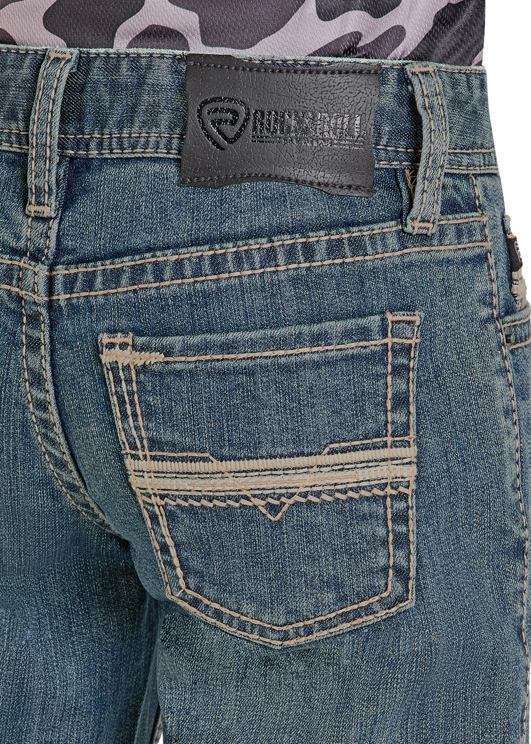 Close-up of blue jeans with a brand label on a white background