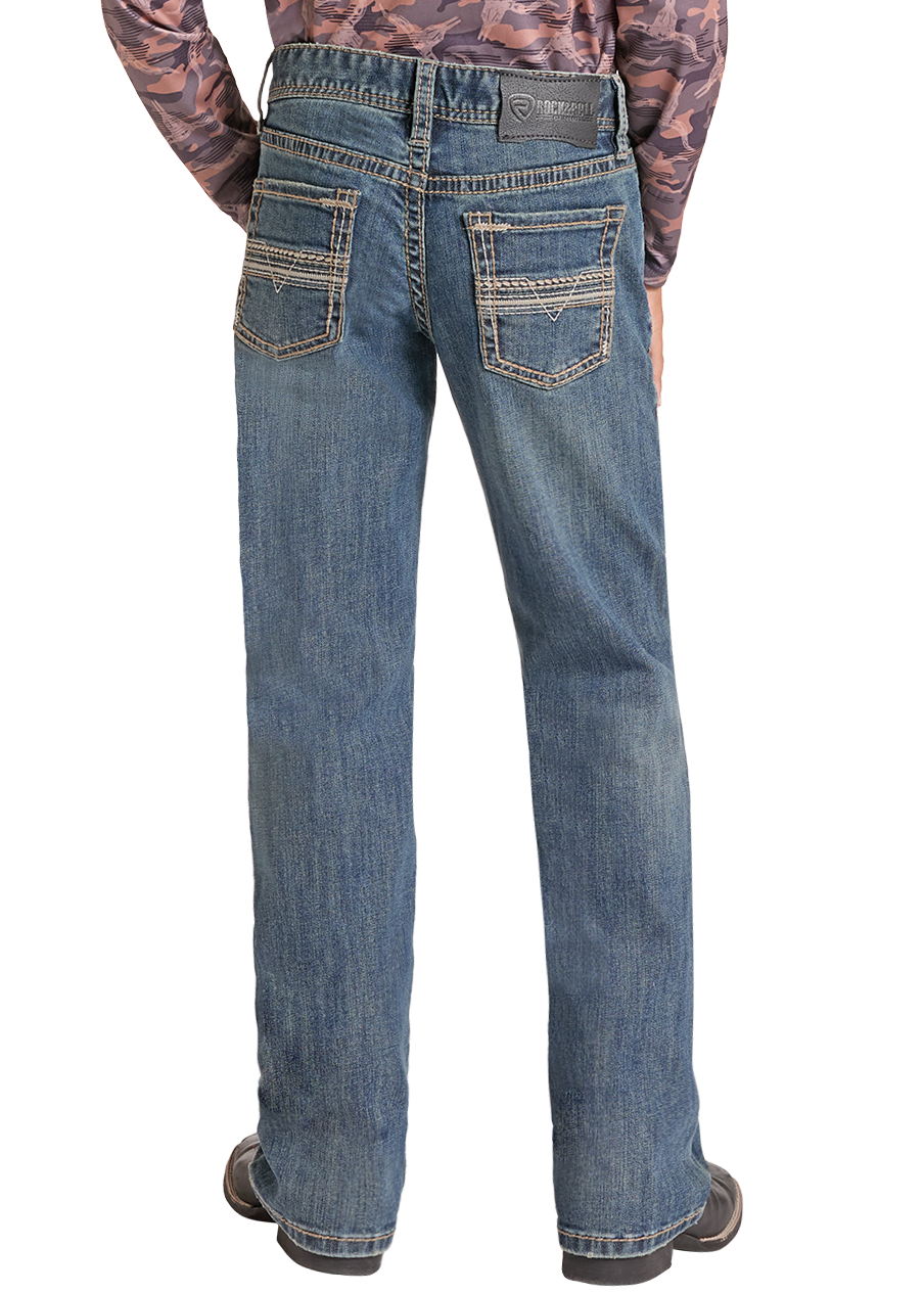 A child shown from the back wearing a long-sleeve camouflage-patterned hoodie, blue jeans, a black cowboy hat, and black shoes against a plain white background.