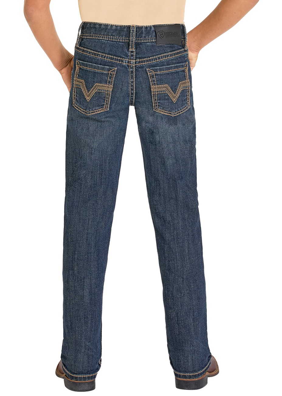 Child wearing blue jeans and a beige shirt with a black cowboy hat on a white background