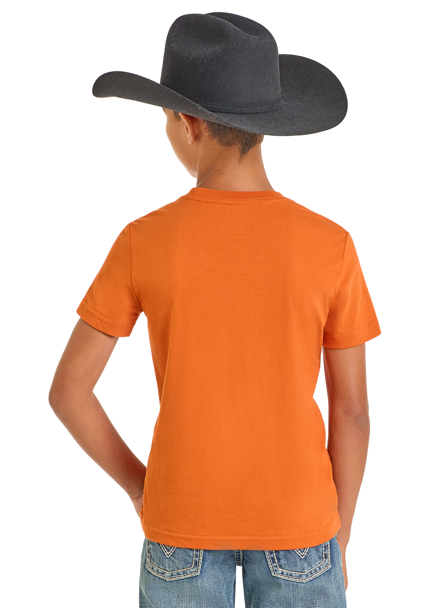 Child wearing an orange t-shirt and blue jeans with a black cowboy hat on a white background