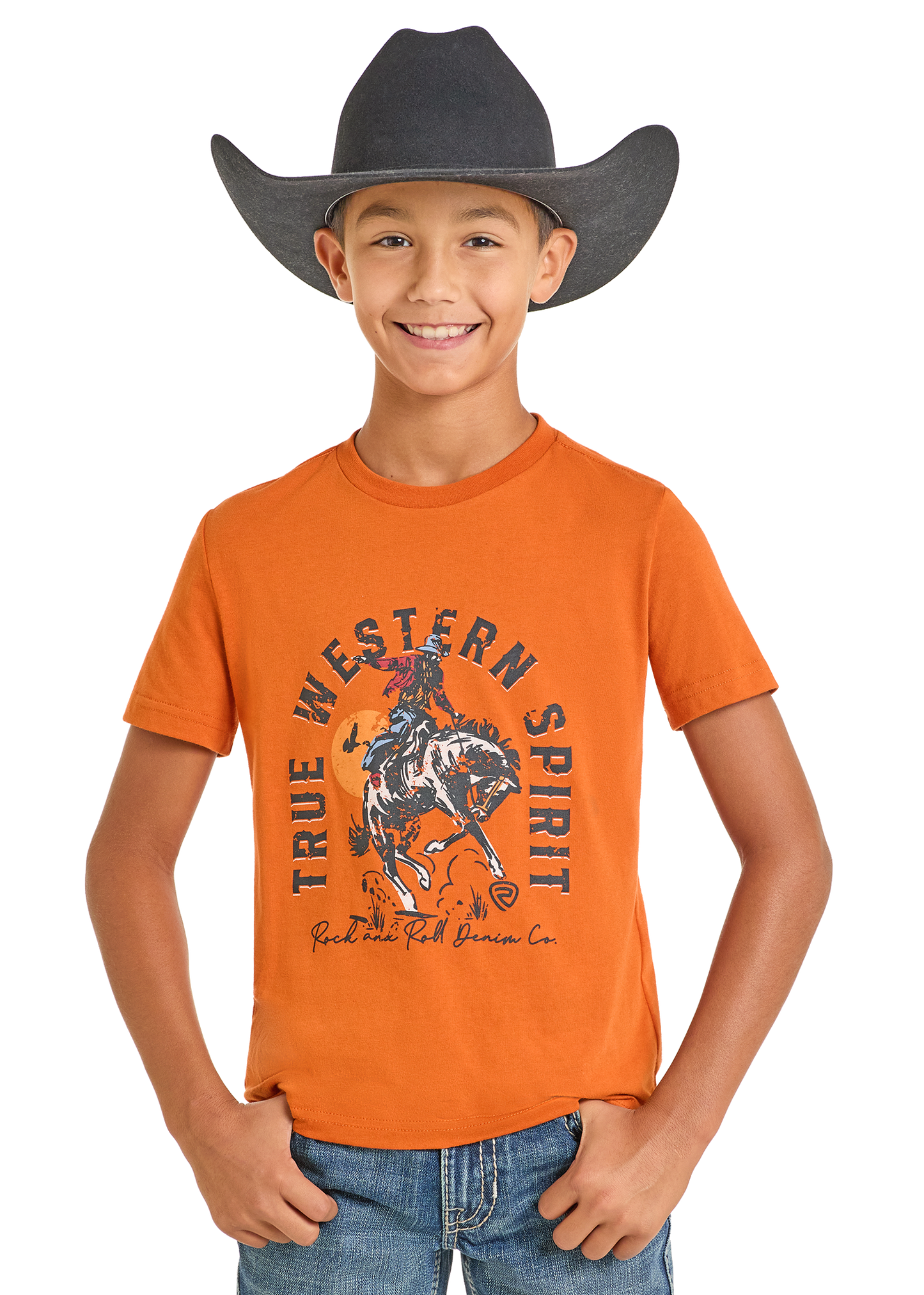 Child wearing an orange t-shirt with a graphic of a cowboy on a horse and text 'True Western Spirit'.