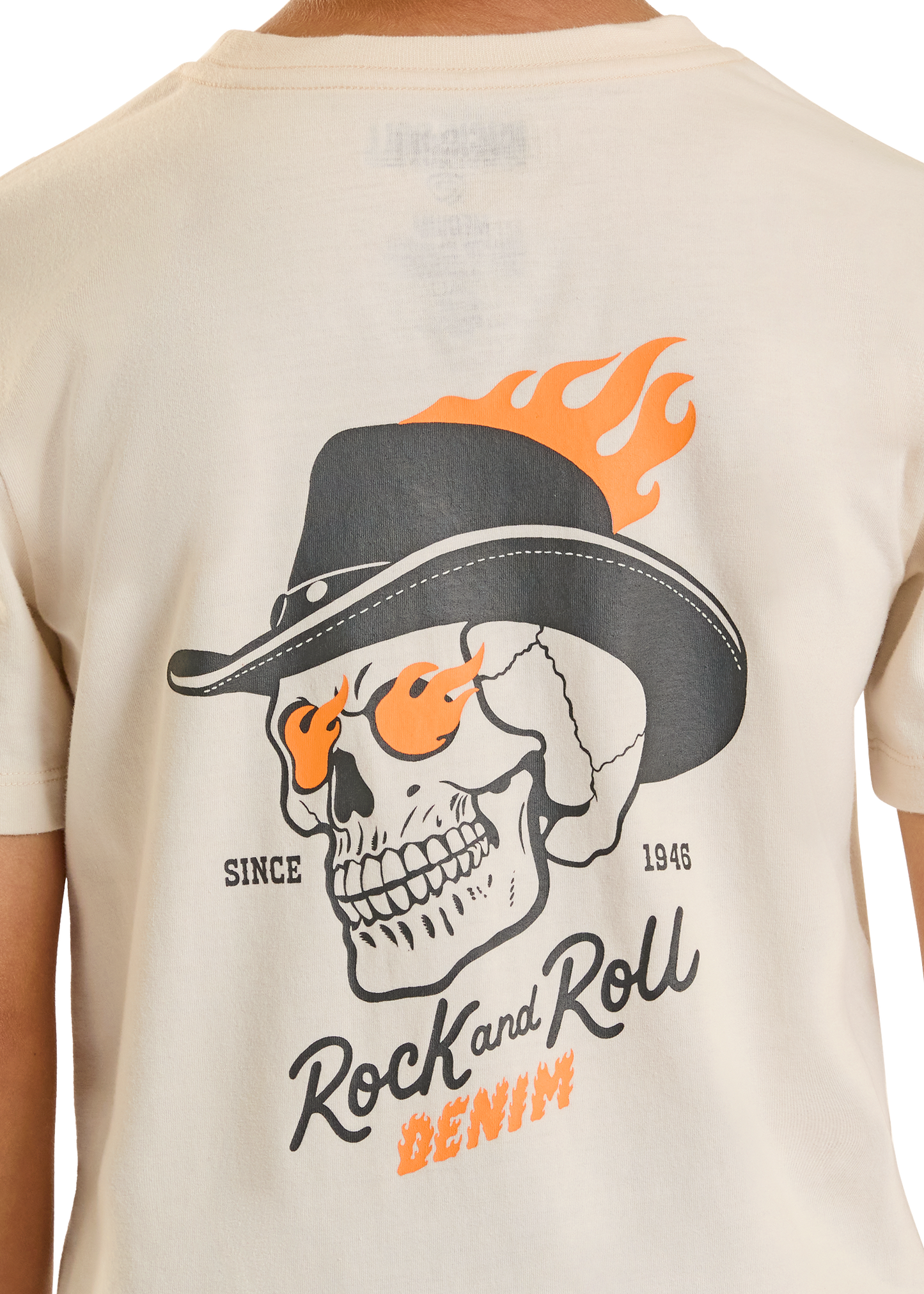 Beige t-shirt with a skull wearing a hat and flames graphic on the back.