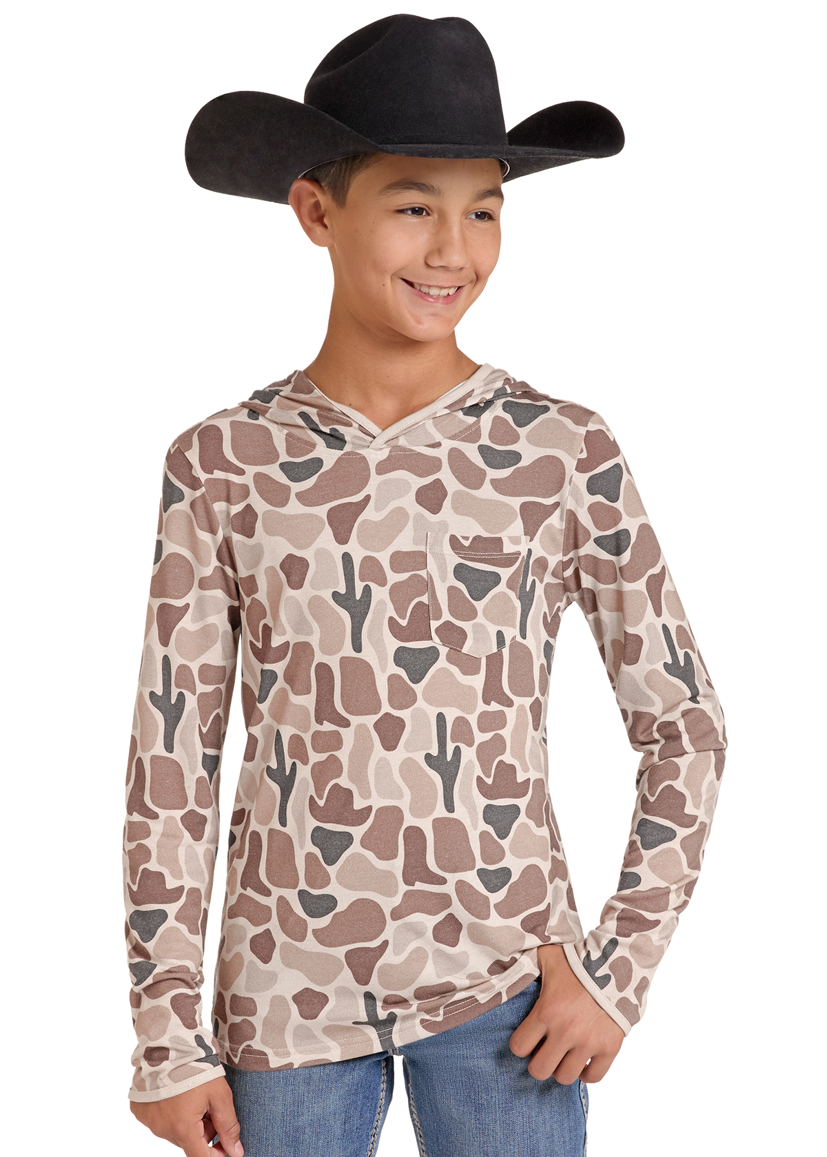 A young boy wearing a black cowboy hat, a beige long-sleeve hooded shirt with a brown and gray cactus and camo pattern, and blue jeans, photographed against a solid white background.