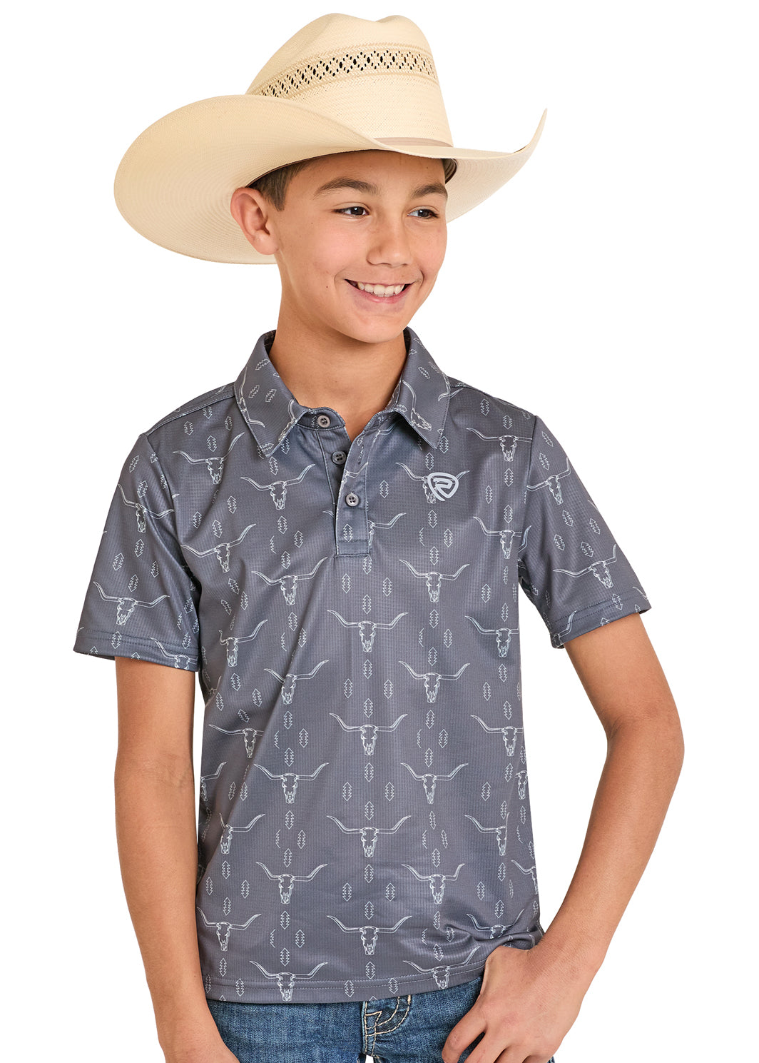 Child wearing a patterned shirt and cowboy hat on a white background