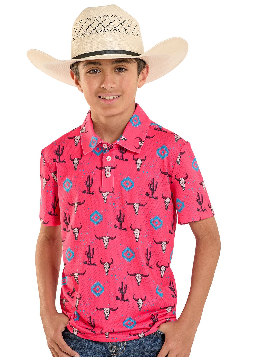 Child wearing a pink polo shirt with cactus and bull skull pattern and a cowboy hat.