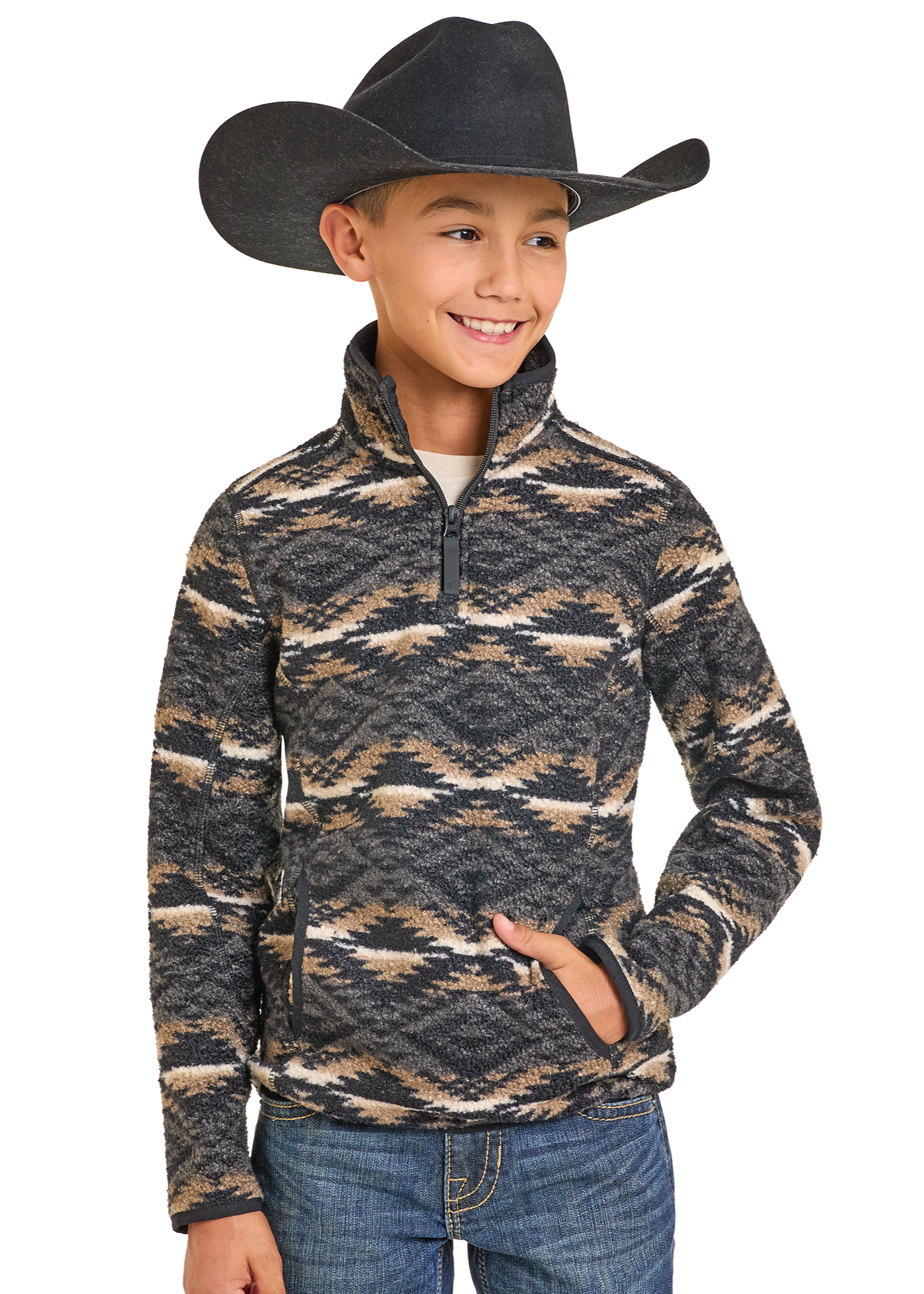 Child wearing a patterned pullover, jeans, and a cowboy hat on a white background