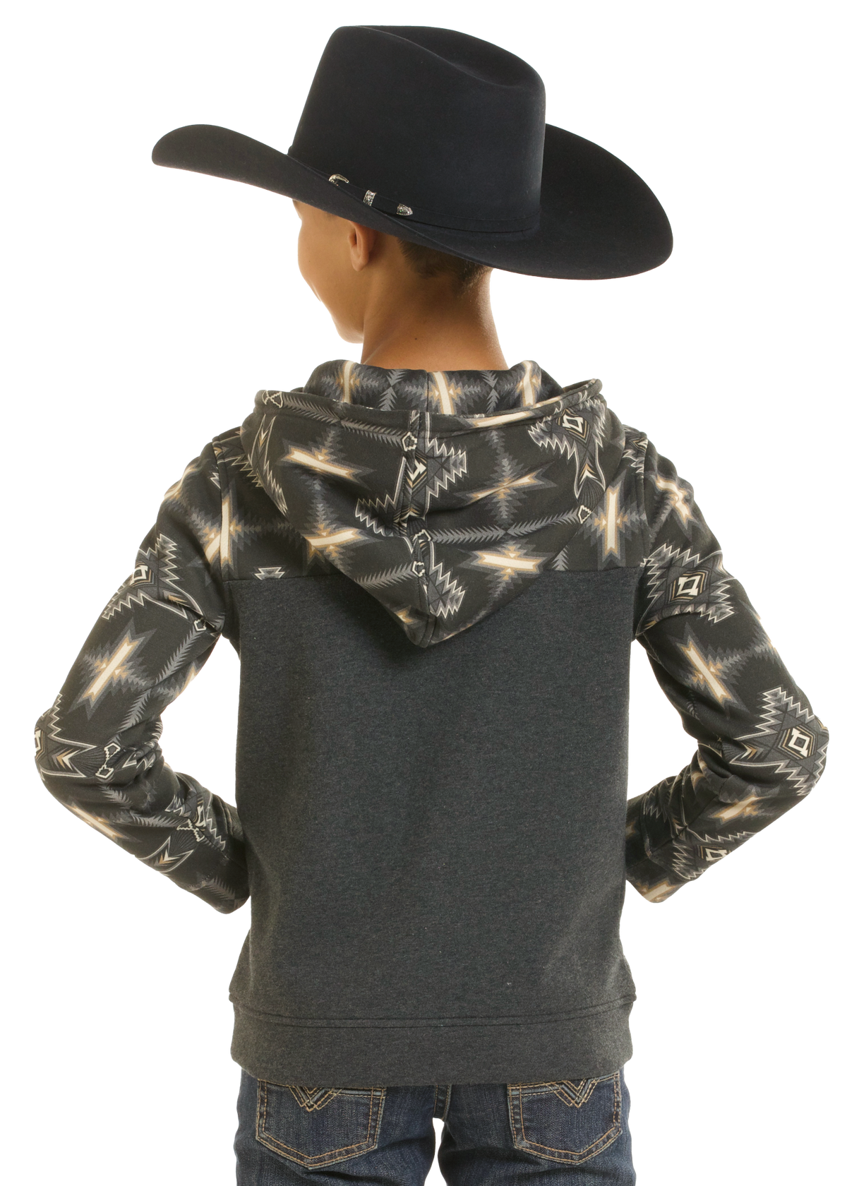 A child shown from the back wearing a dark gray hoodie with a black and beige southwestern-style patterned hood and sleeves, along with a black cowboy hat and blue jeans, against a white background.