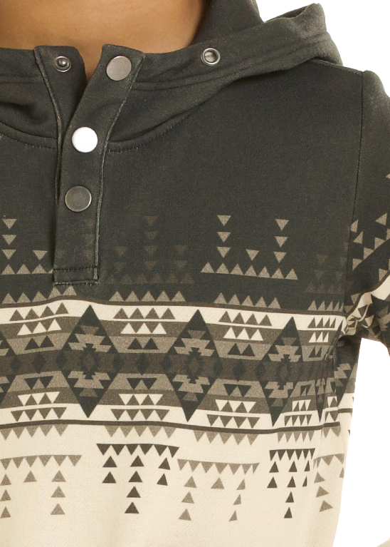 Close up of a  cream and dark gray patterned hoodie with snap closures