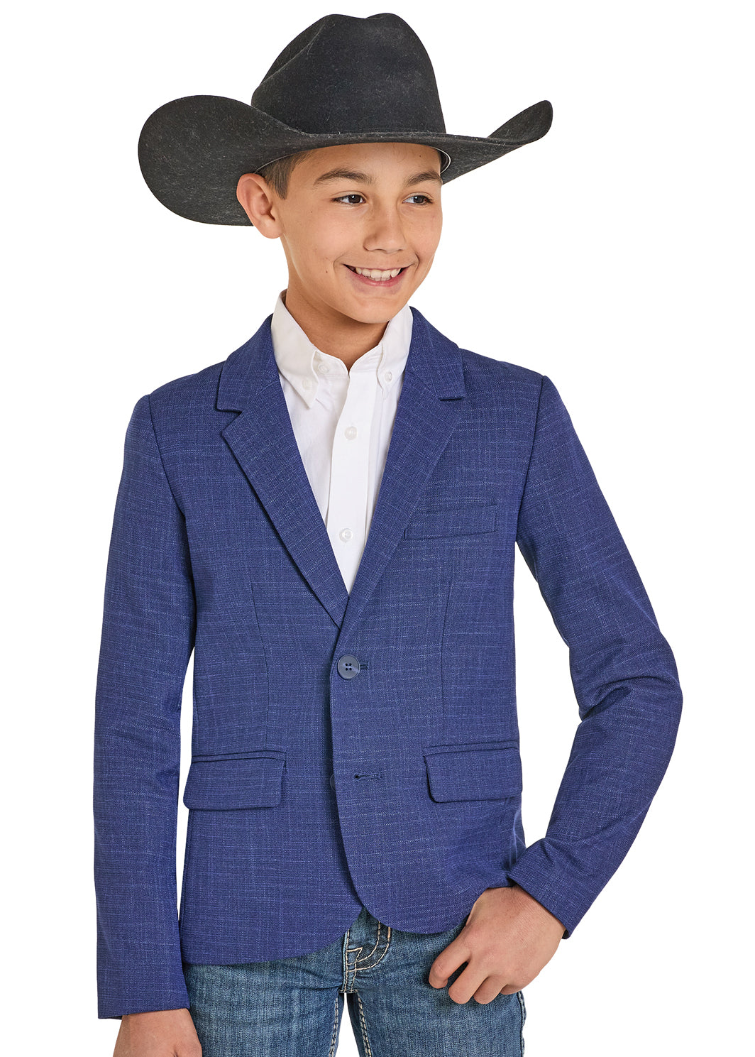 A young boy in a black cowboy hat, white button-up shirt, blue jeans, and the Rock & Roll Denim Boys' Crosshatch Sports Coat smiles to the side against a plain white background—ideal for any formal occasion.