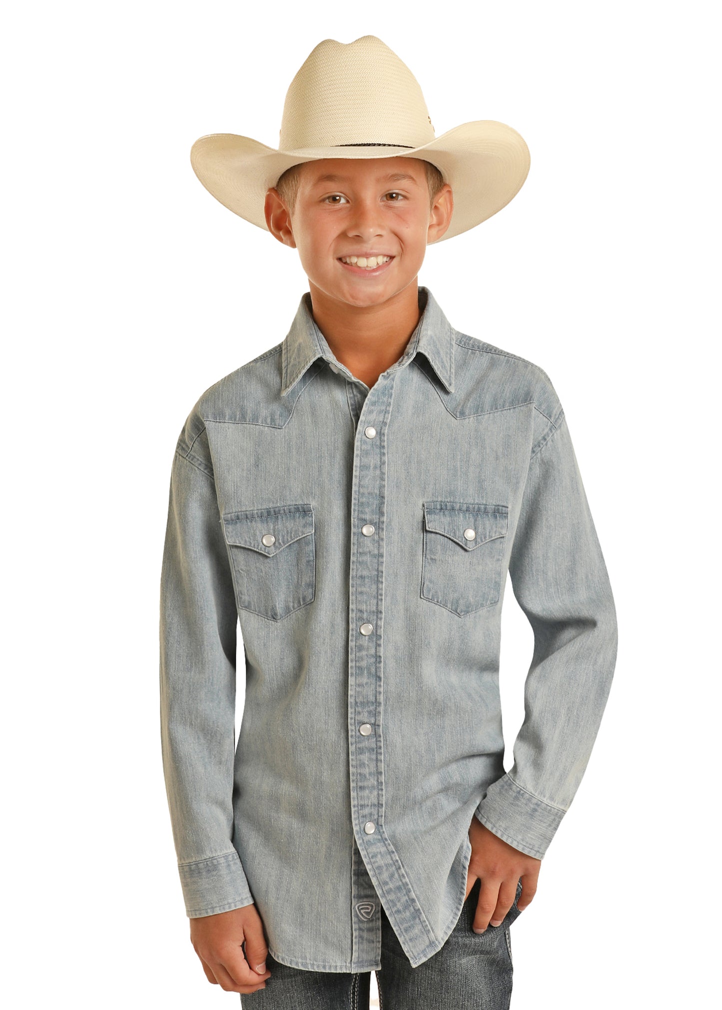 Child wearing a denim shirt and cowboy hat on a white background