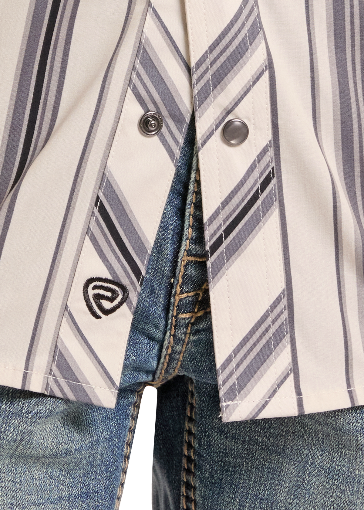 Detail shot of a boys pearl snap stripe shirt