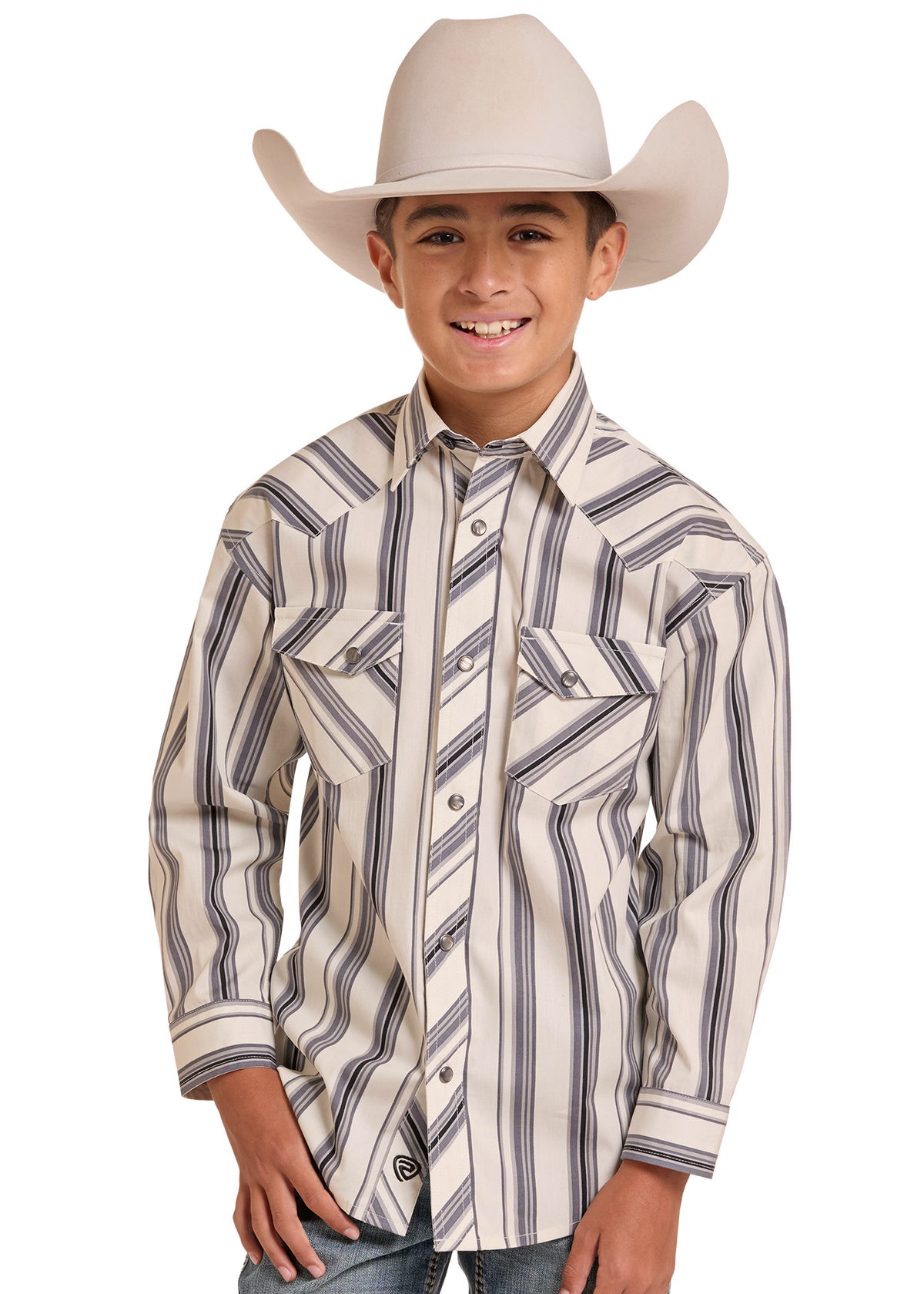 A young boy wearing a cream-colored cowboy hat and a matching cream western shirt with dark gray vertical stripes, paired with blue jeans, photographed against a solid white background.