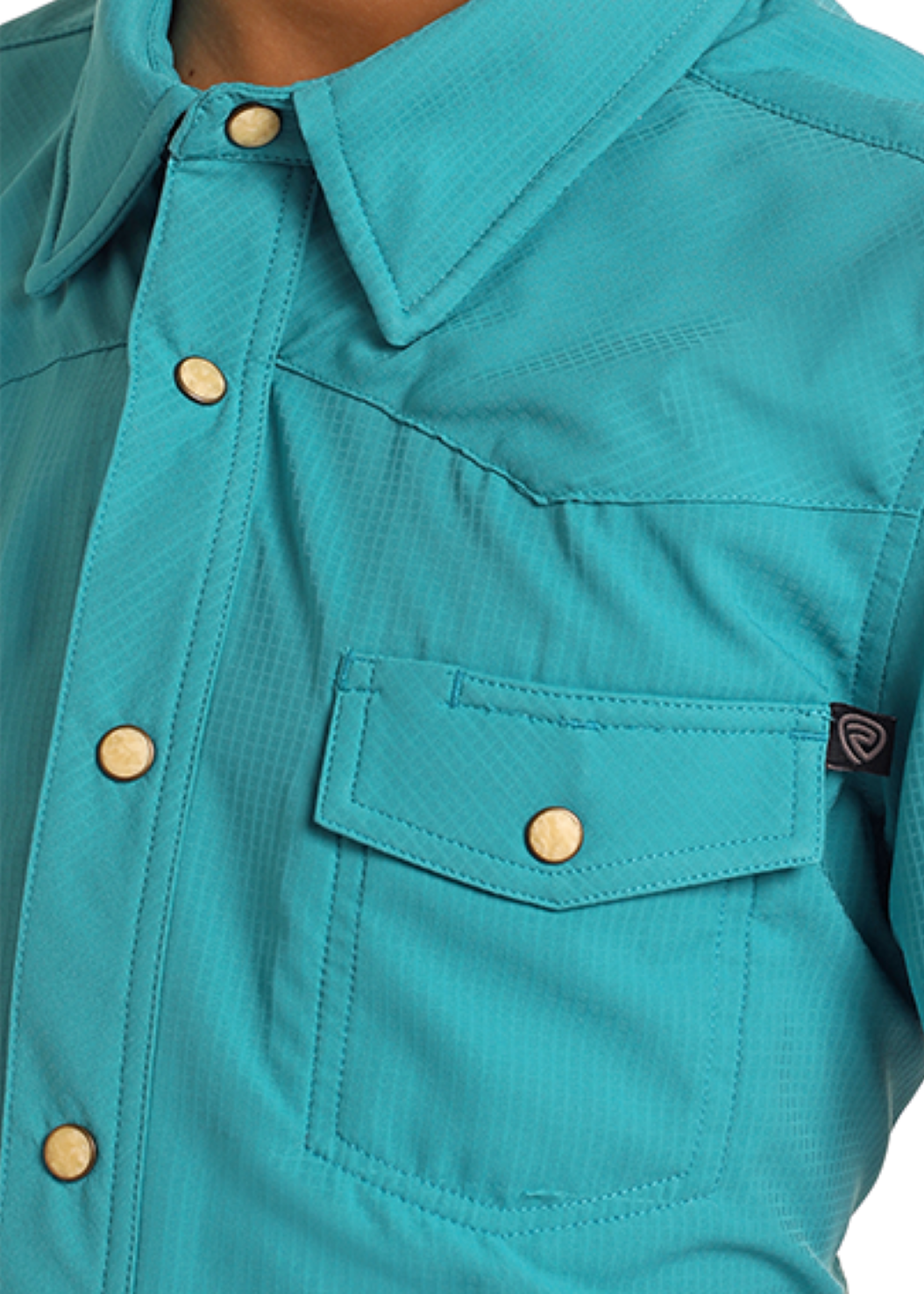 Close-up of a turquoise shirt with short sleeves and snap details on a white background