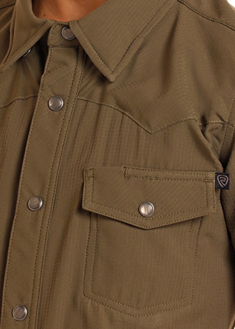 Close-up of a olive short-sleeve shirt with snaps and a collar.