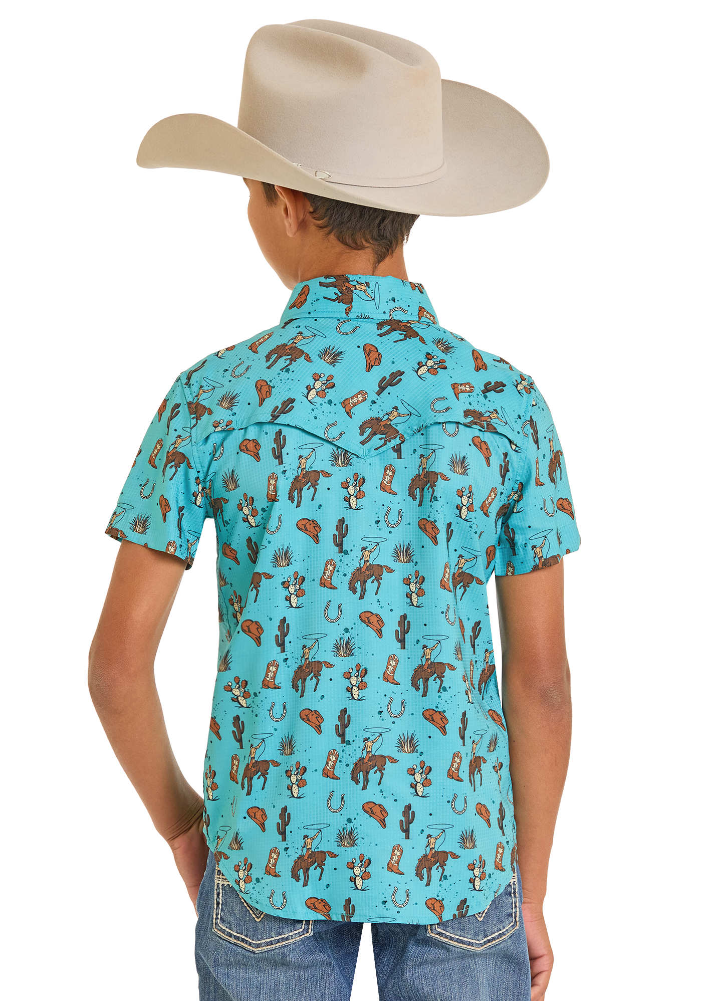 Child wearing a turquoise cowboy-themed shirt with a white background