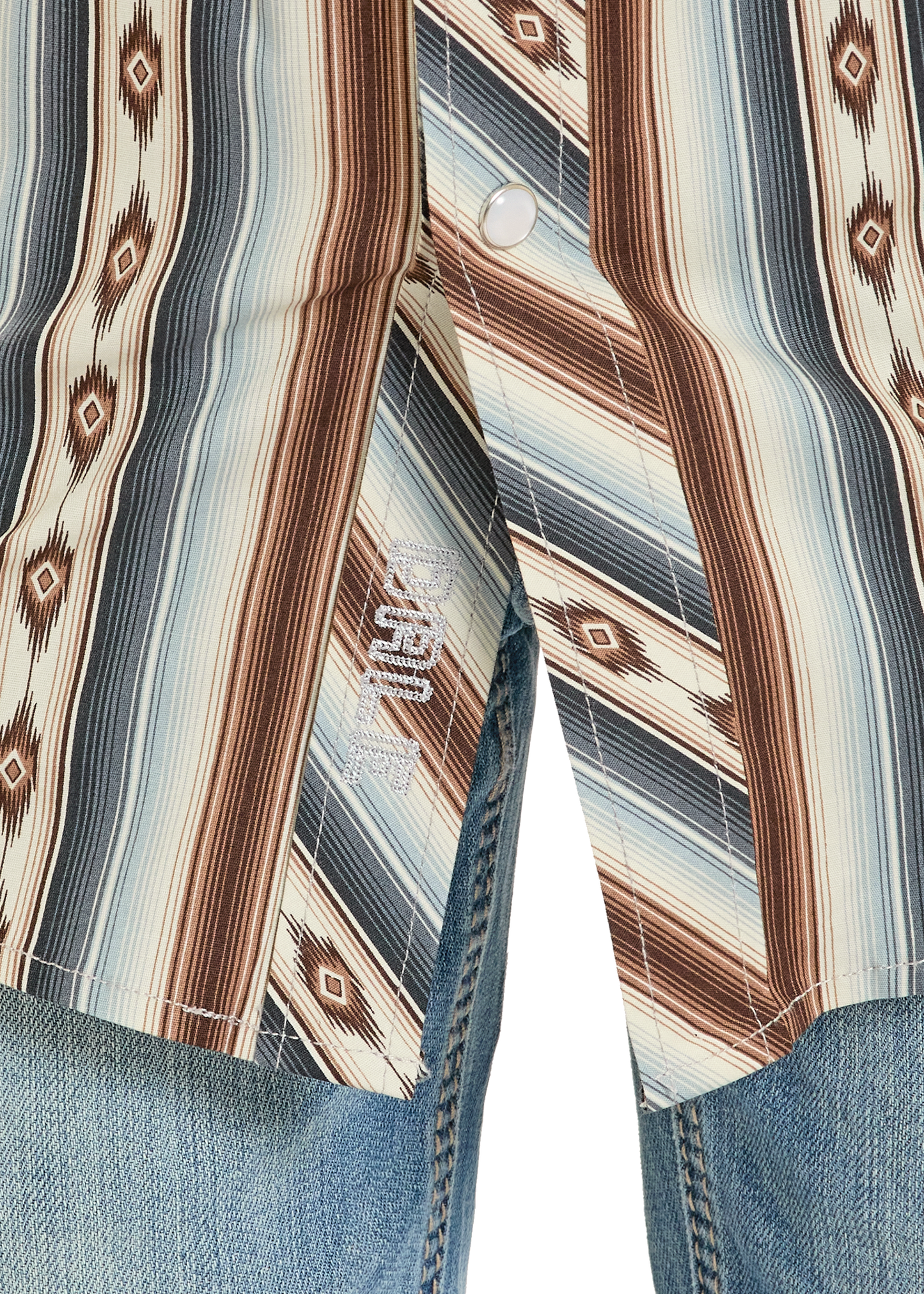 Close-up of a patterned shirt with a brand logo on a white background