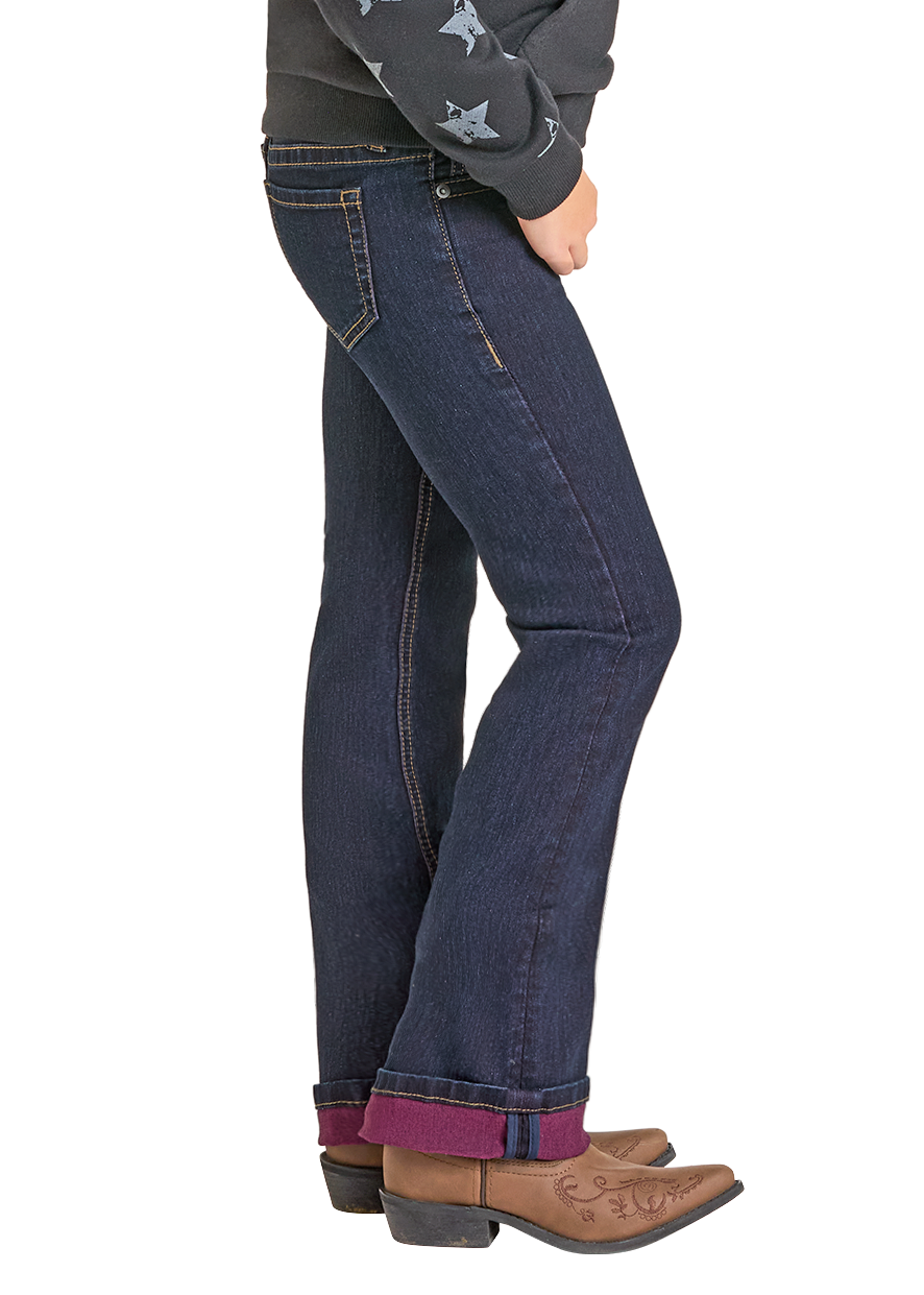 Person wearing a gray hoodie with star patterns and blue jeans, standing against a white background.