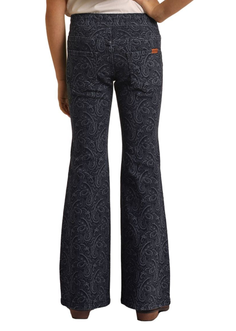 Person wearing a black hat, white shirt, and dark patterned pants on a white background