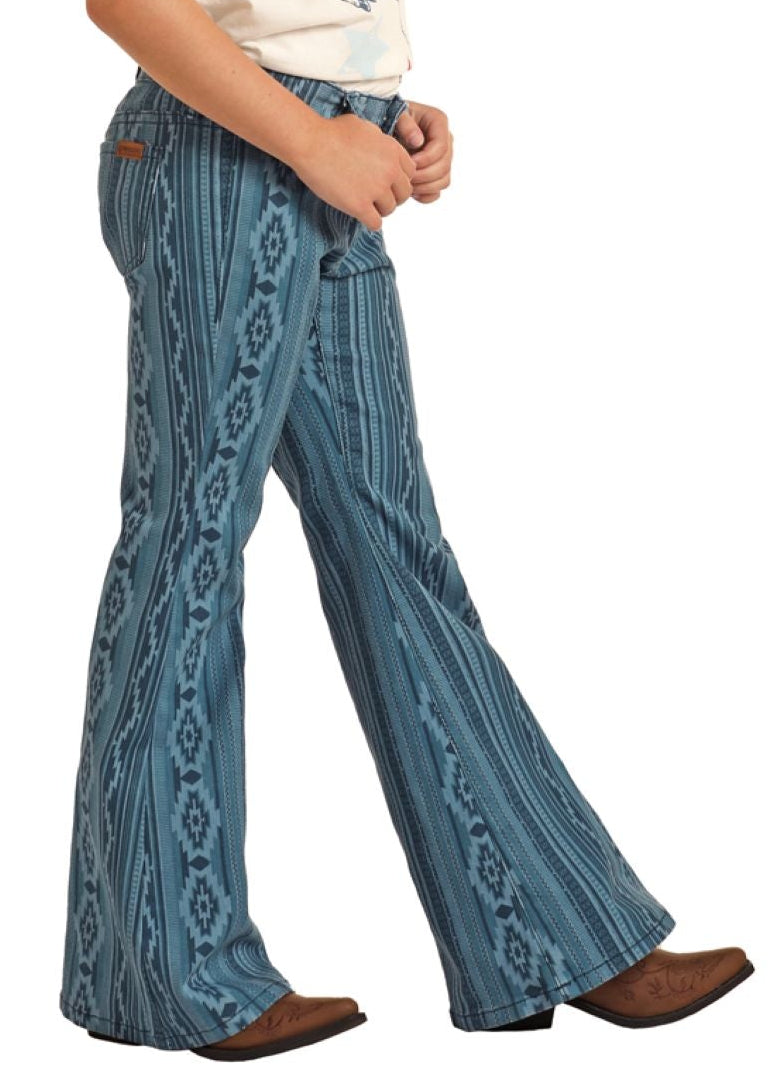 Child wearing a cowboy hat, white t-shirt, and blue patterned jeans on a white background