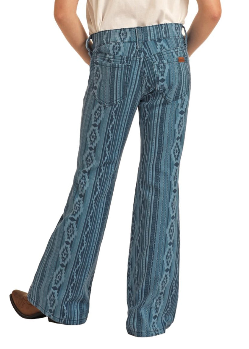 Person wearing a white shirt, blue patterned pants, and a cowboy hat on a white background