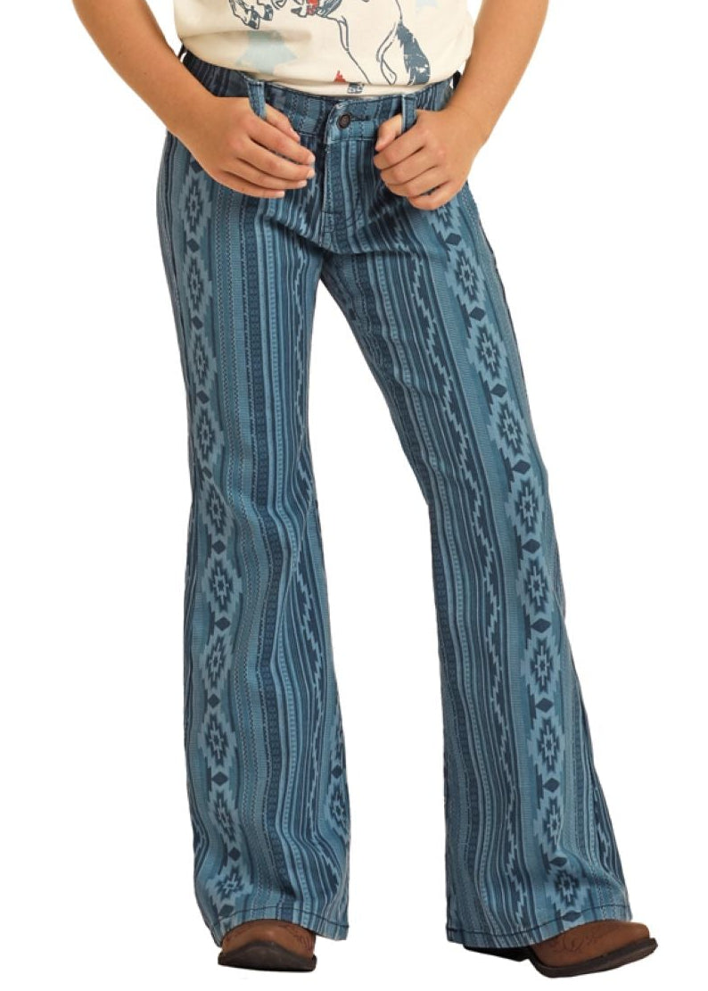 Child wearing a cowboy hat, white t-shirt with graphic design, and blue patterned pants on a white background