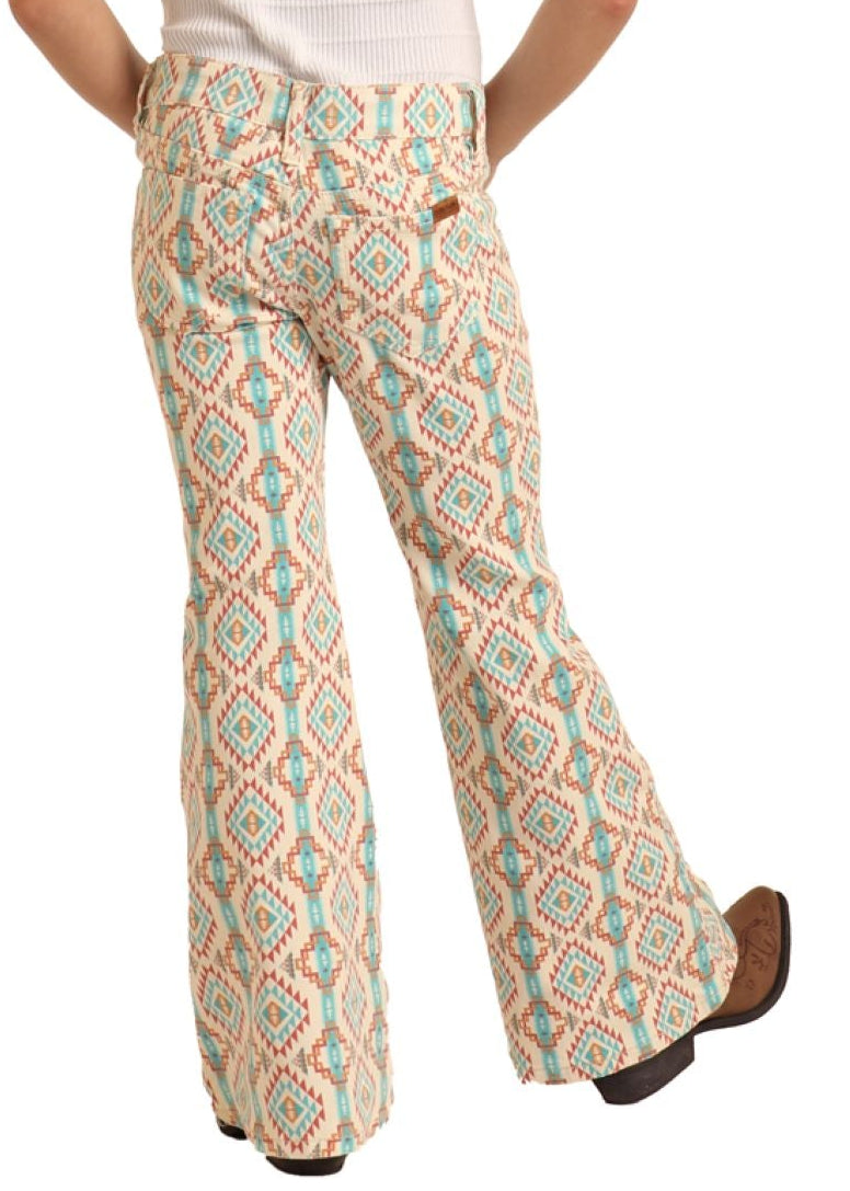 Person wearing a white t-shirt and patterned pants with a cowboy hat on a white background