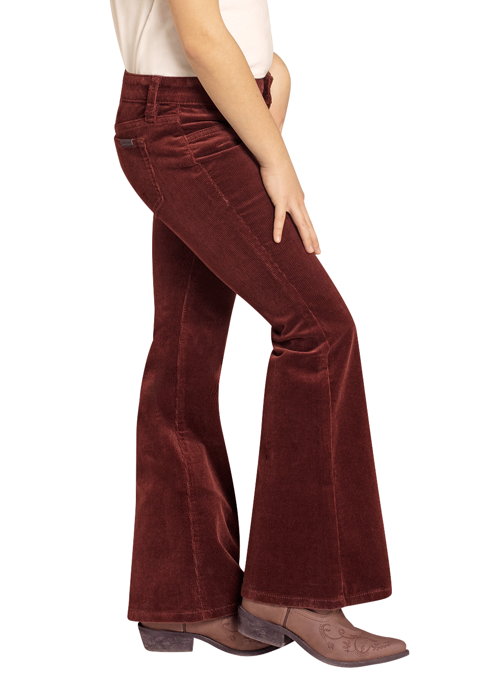 Woman wearing a beige cowboy hat and red flared pants on a white background