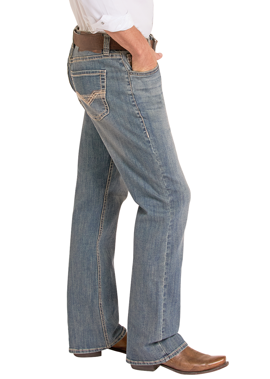 Side of man wearing a white shirt, jeans and cowboy boots.