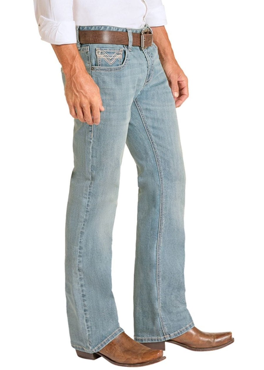Man wearing a white shirt, light blue jeans, and a beige hat on a white background