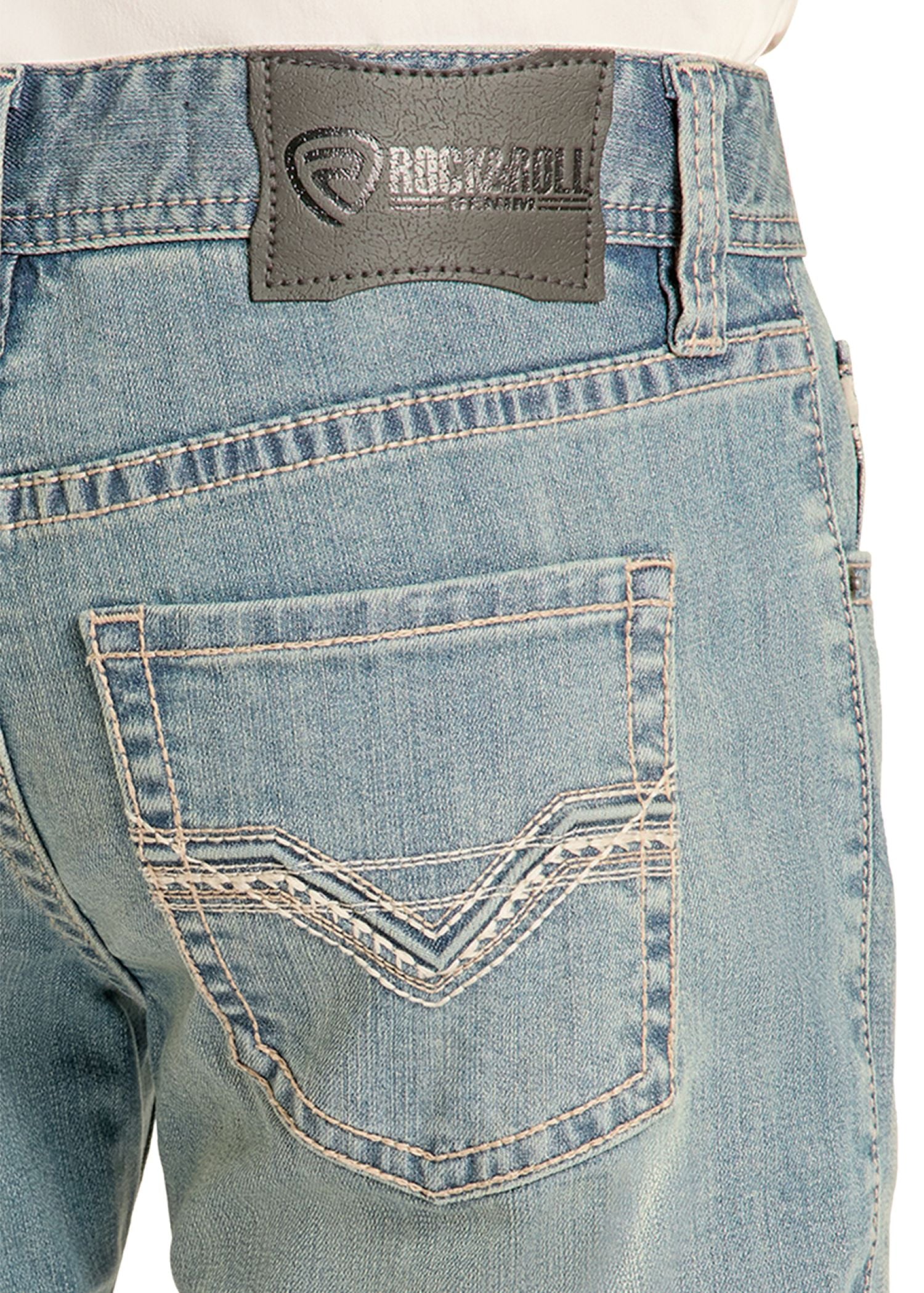 Close-up of blue jeans with a visible brand label on the back pocket.
