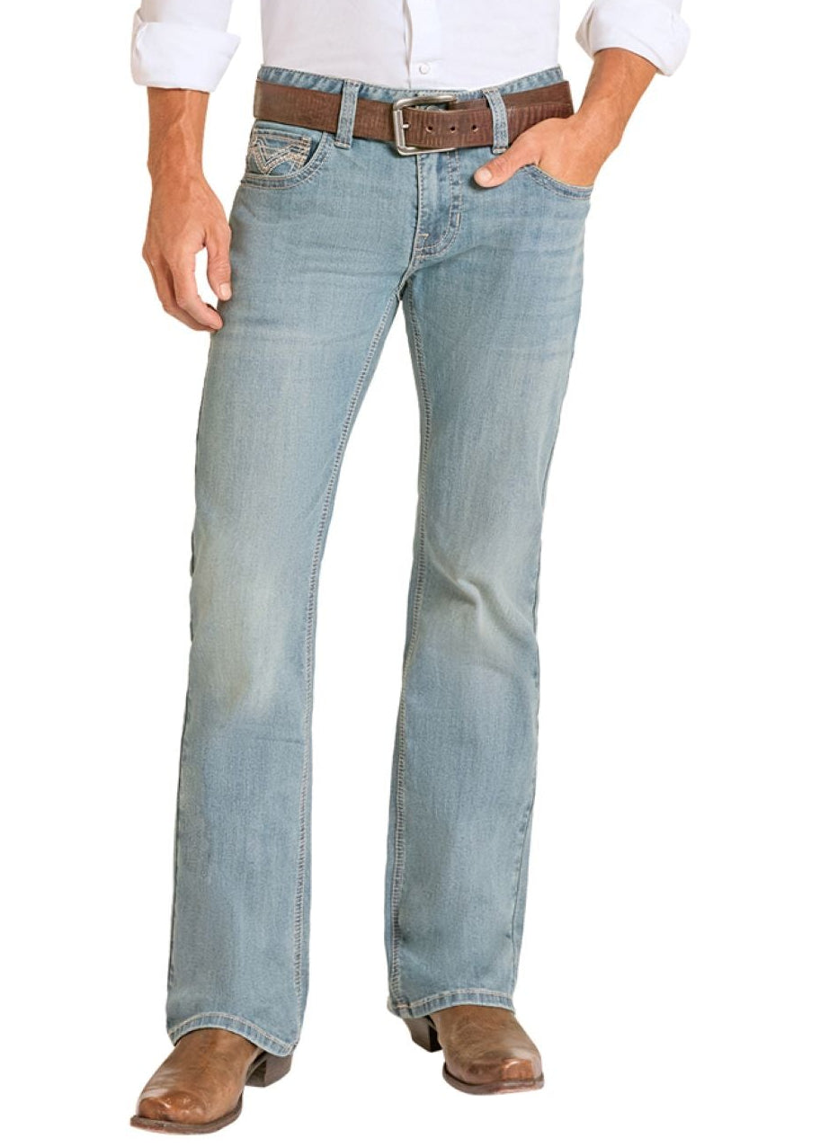 Man wearing a white shirt, light blue jeans, and a cowboy hat on a white background