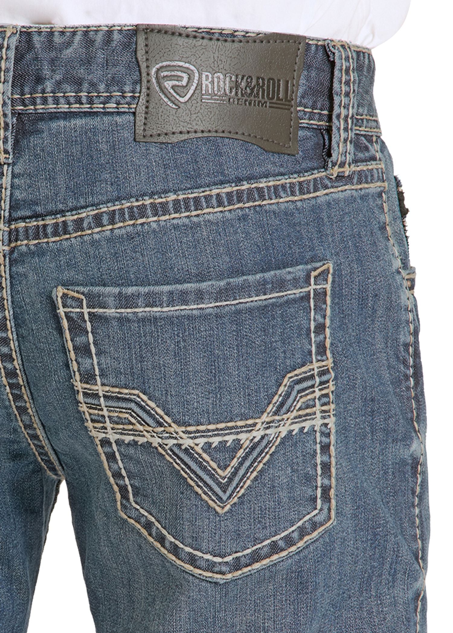 Close-up of blue jeans with a brand label on the pocket area.