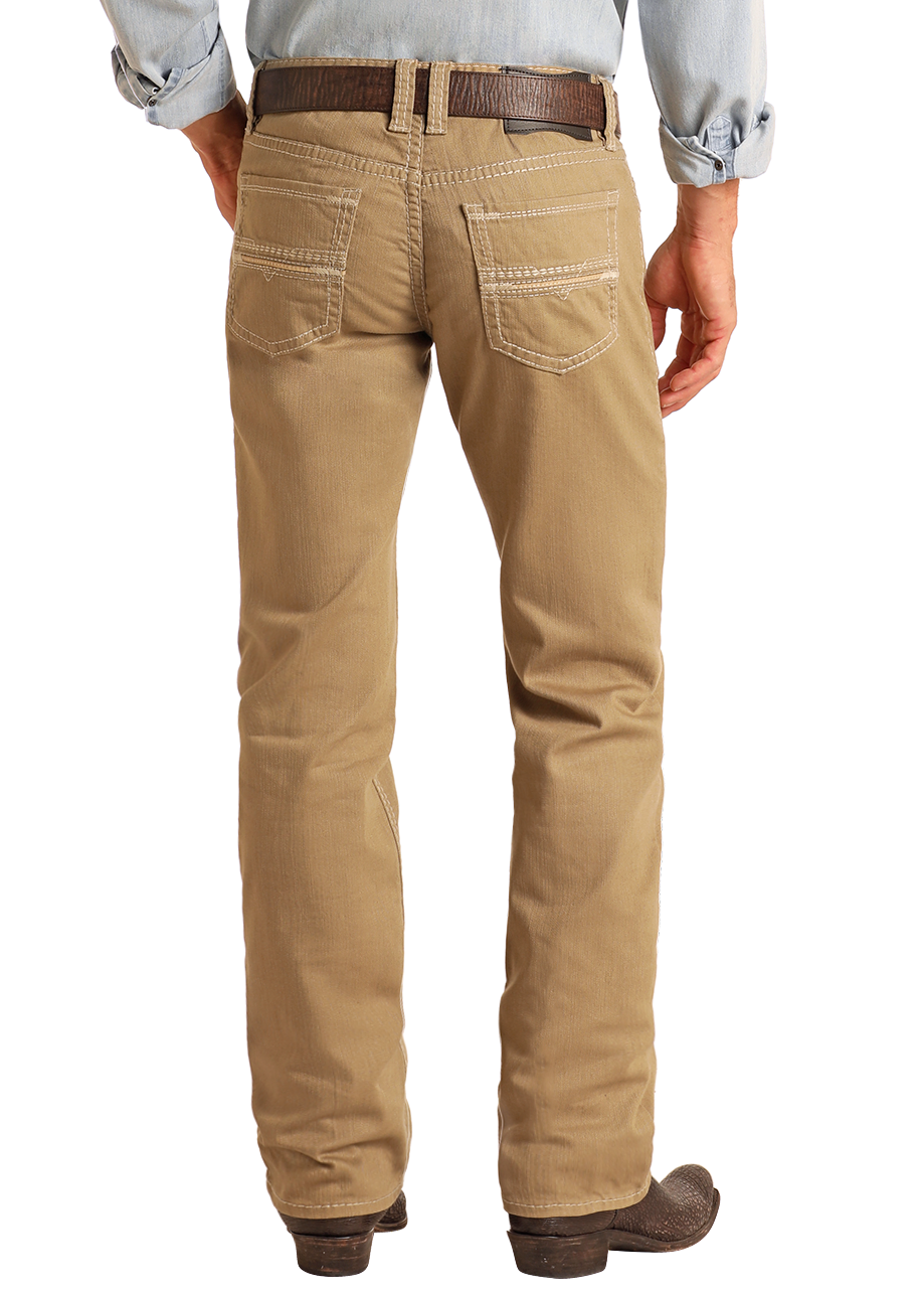 Man wearing a light blue shirt, beige pants, and cowboy boots on a white background