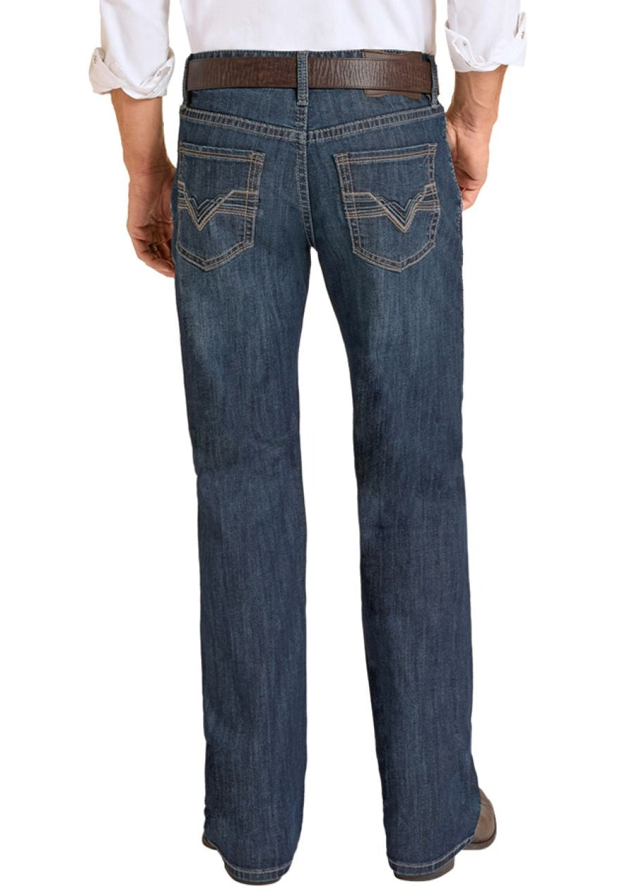 Man wearing a white shirt, blue jeans, and cowboy boots on a white background