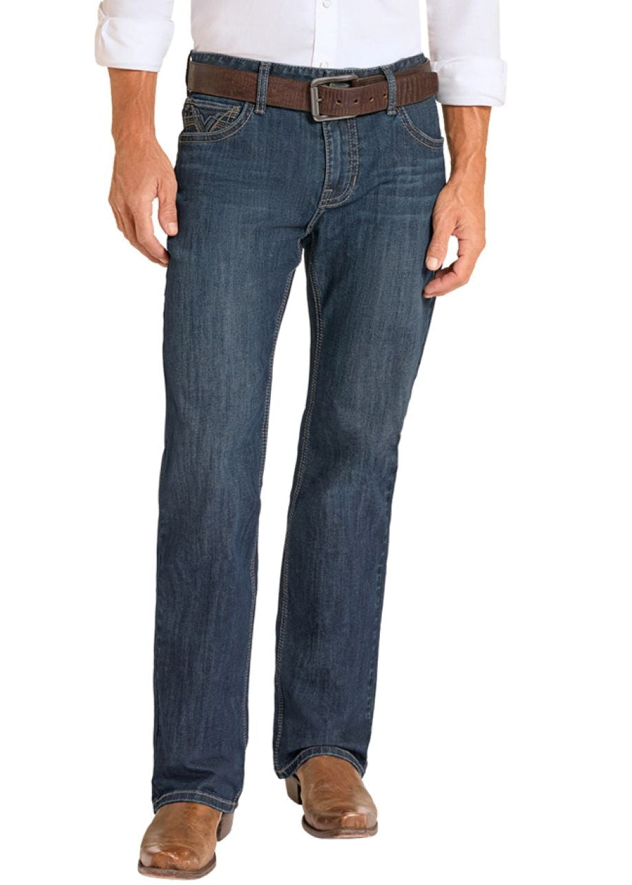 Man wearing a white shirt, blue jeans, and cowboy boots on a white background