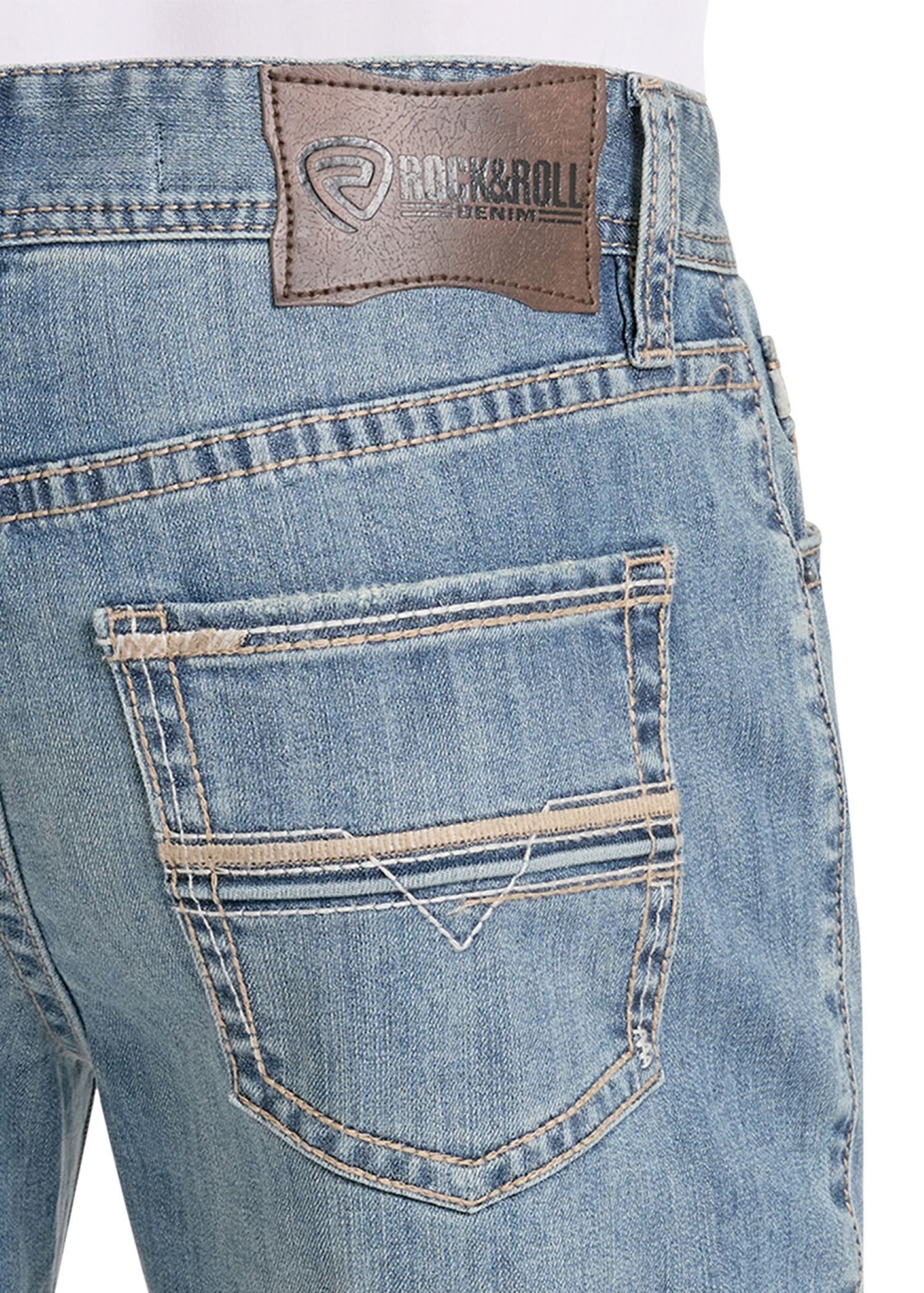 Close-up of blue jeans with a brand label on a white background