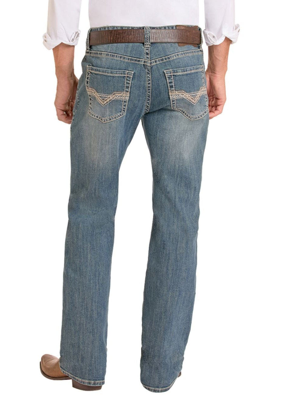Man wearing a white shirt, blue jeans, and cowboy boots on a white background