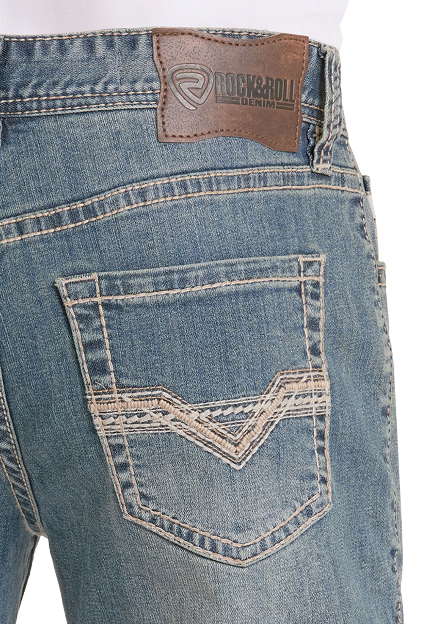 Close-up of blue jeans with a brand label on the back pocket.