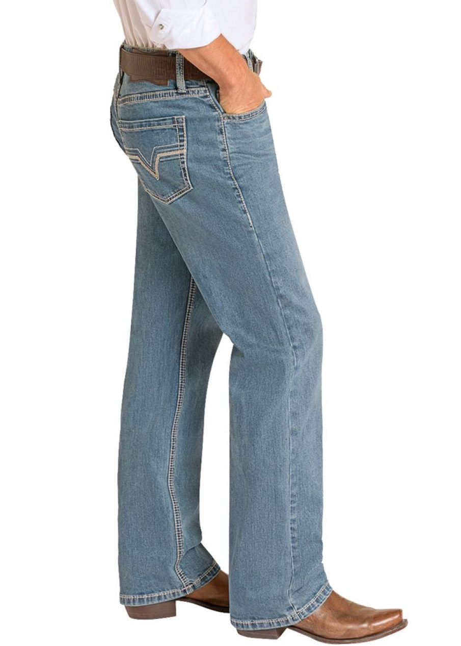 Man wearing a white shirt, blue jeans, and cowboy boots on a white background