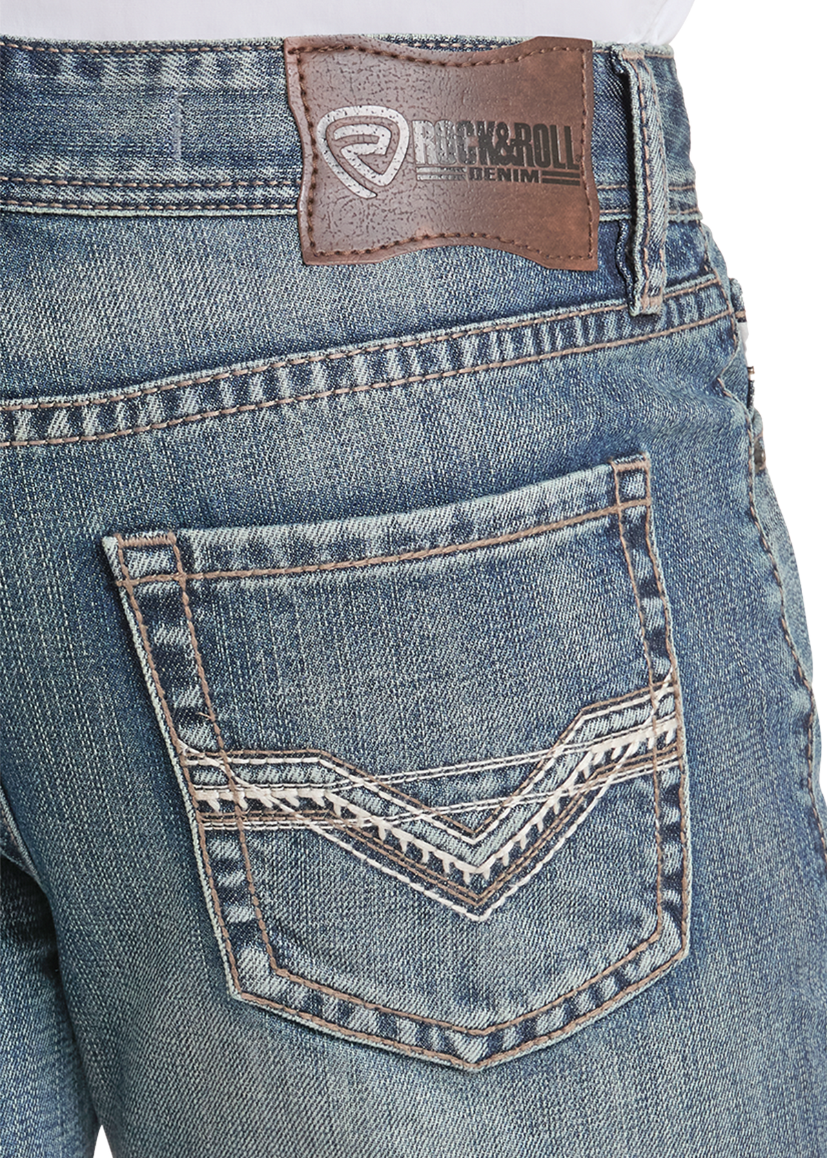 Close-up of the back waistband and pocket area of blue denim jeans, showing a brown leather Rick & Roll brand patch and decorative contrast stitching on the back pocket.