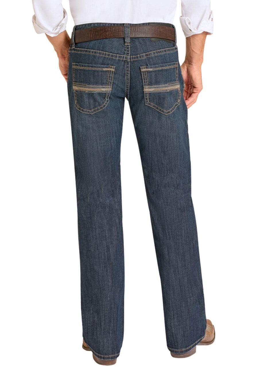Man wearing a white shirt, blue jeans, and cowboy boots on a white background