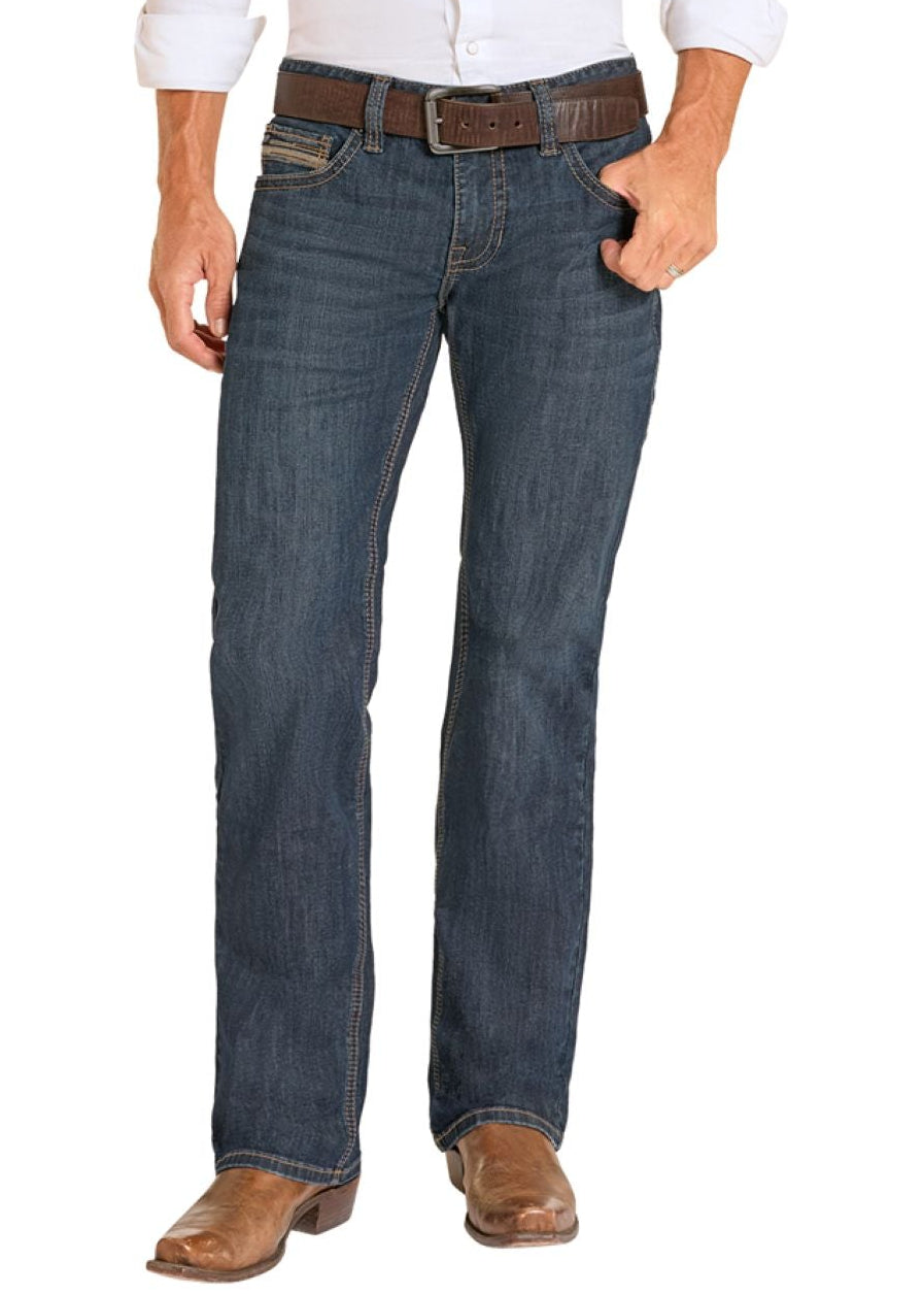 Man wearing a white shirt, blue jeans, and cowboy boots on a white background