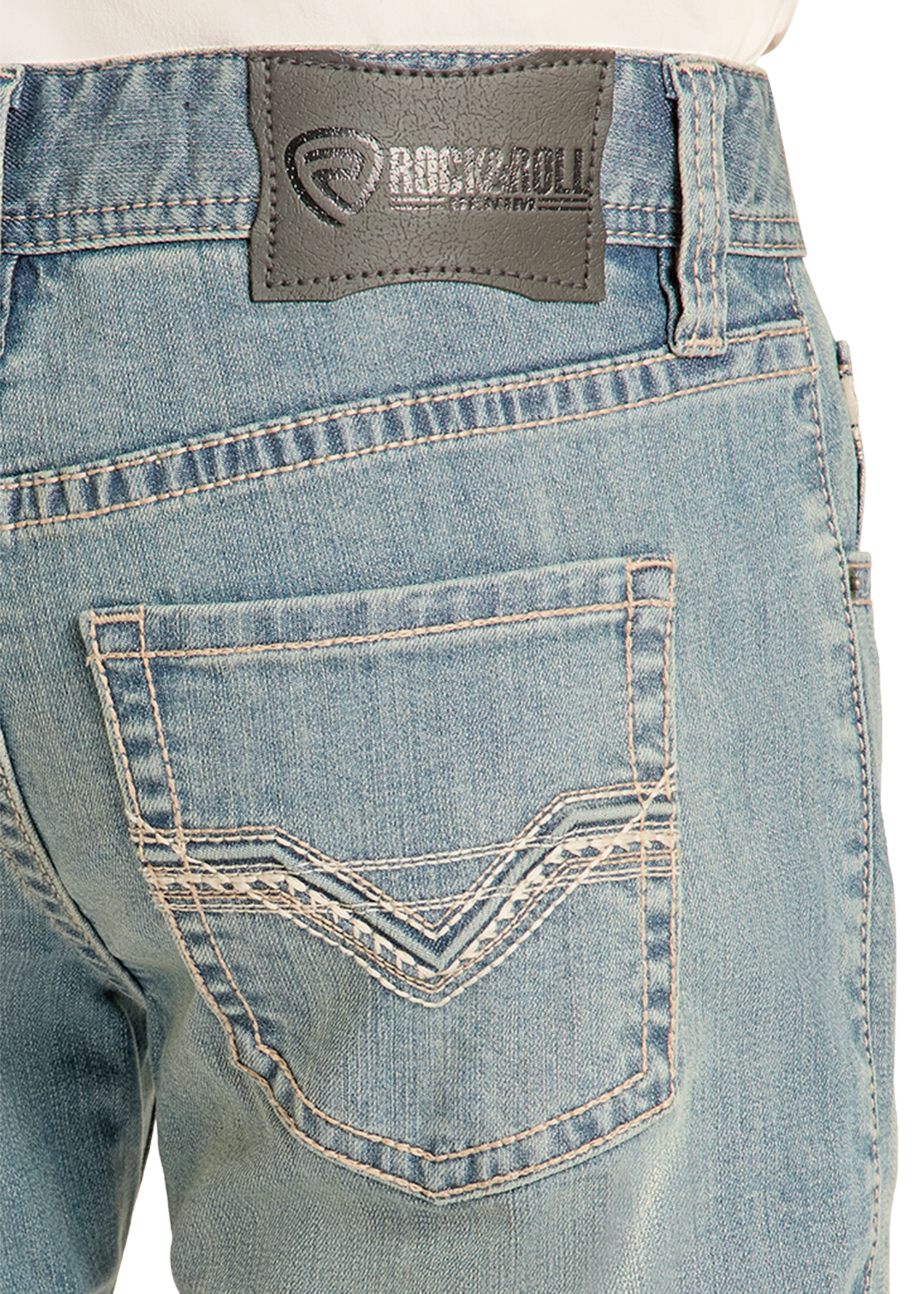 Close-up of blue jeans with a visible brand label on the back pocket.