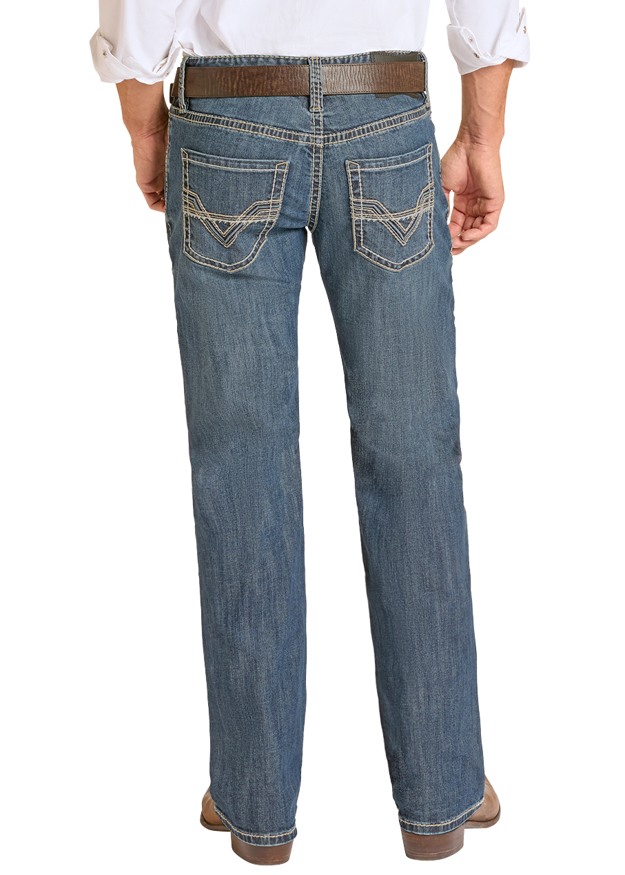 Man wearing Rock & Roll Denim jeans with a white shirt and boots. 