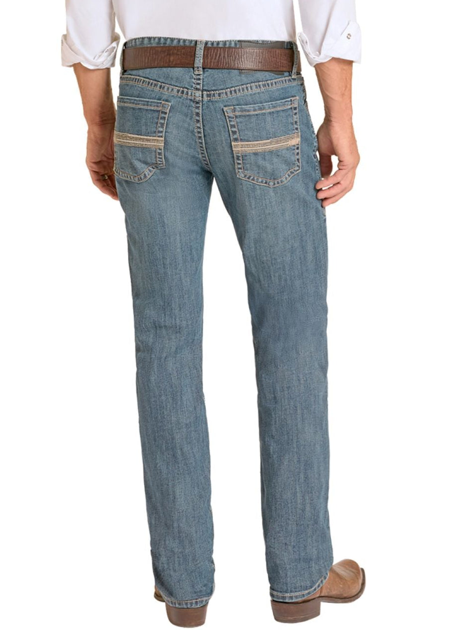 Man wearing a white shirt, blue jeans, and cowboy boots on a white background