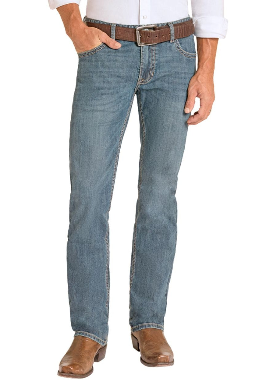 Man wearing a white shirt, blue jeans, and  cowboy boots on a white background