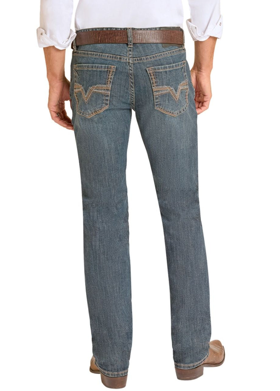 Man wearing a white shirt, blue jeans, and cowboy boots on a white background