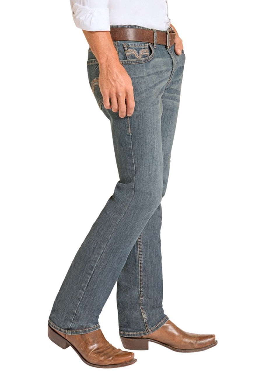 Man wearing a white shirt, blue jeans, and cowboy boots on a white background