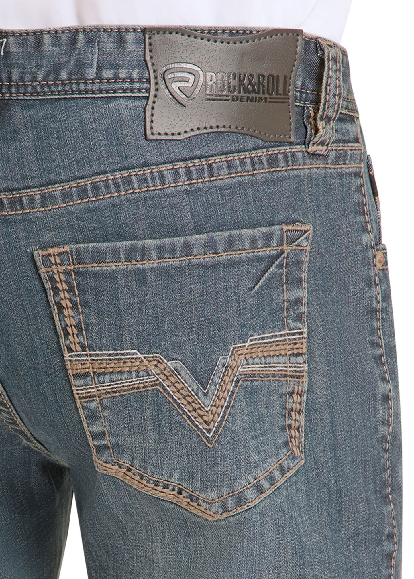 Close-up of blue jeans with a brand label on a white background