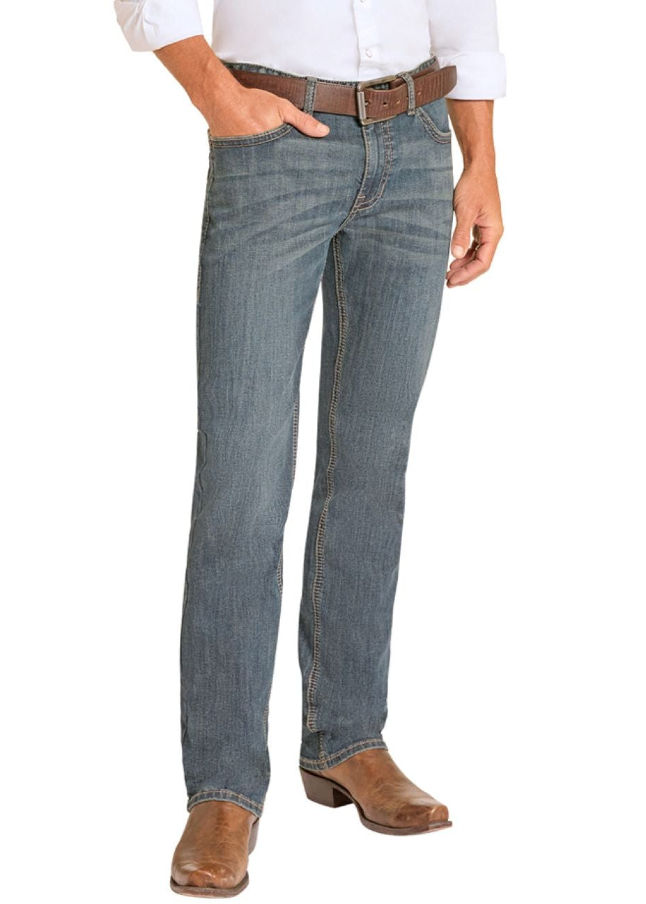 Man wearing a white shirt, blue jeans, and cowboy boots on a white background